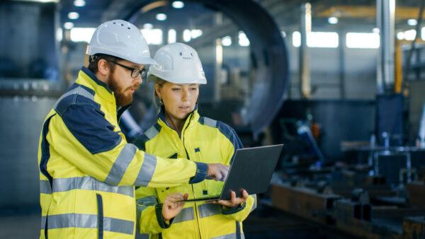 Male,And,Female,Industrial,Engineers,In,Hard,Hats,Discuss,New